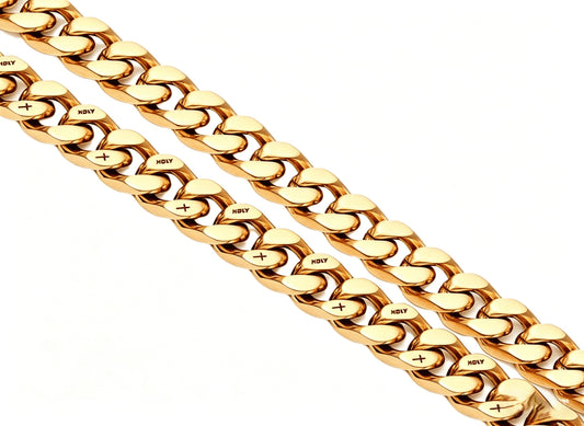 Coiled 12MM 18k gold cross Cuban link chain against a white background showing its wide link structure with its box clasp
