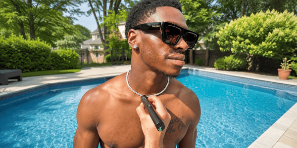 Man wearing a moissanite tennis chain while its shine is checked outdoors, illustrating whether moissanite tarnishes, gets cloudy, or loses brilliance.