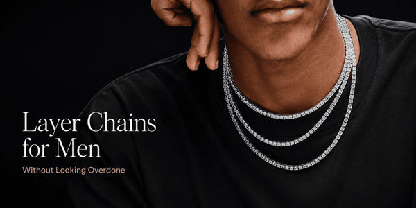 Man wearing three layered silver tennis chains over a black shirt, with the text “Layer Chains for Men Without Looking Overdone.”