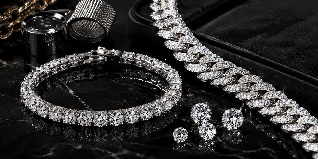 IceGrind moissanite tennis bracelet and iced-out moissanite chain on black marble, highlighting high-quality moissanite fire, stone clarity, and premium hip hop jewelry craftsmanship.