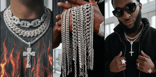  A neck view shows multi-layered diamond tennis and Cuban link chainswith a large lcegrind Jesus cross pendant over a black flame-patterned t-shirt.