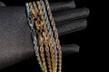 IceGrind rope chain collection featuring gold, silver, and rose gold rope chains on a black glove