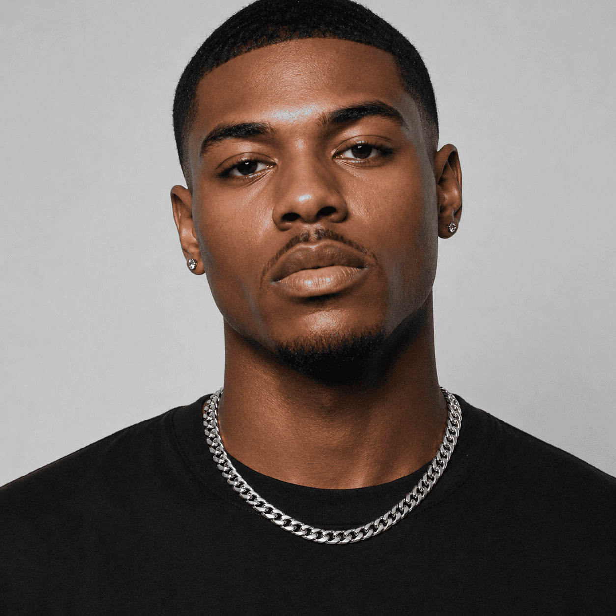 Handsome model wearing the bold IceGrind 8mm White Gold Miami Cuban Link Chain. An essential streetwear cuban link miami chain.