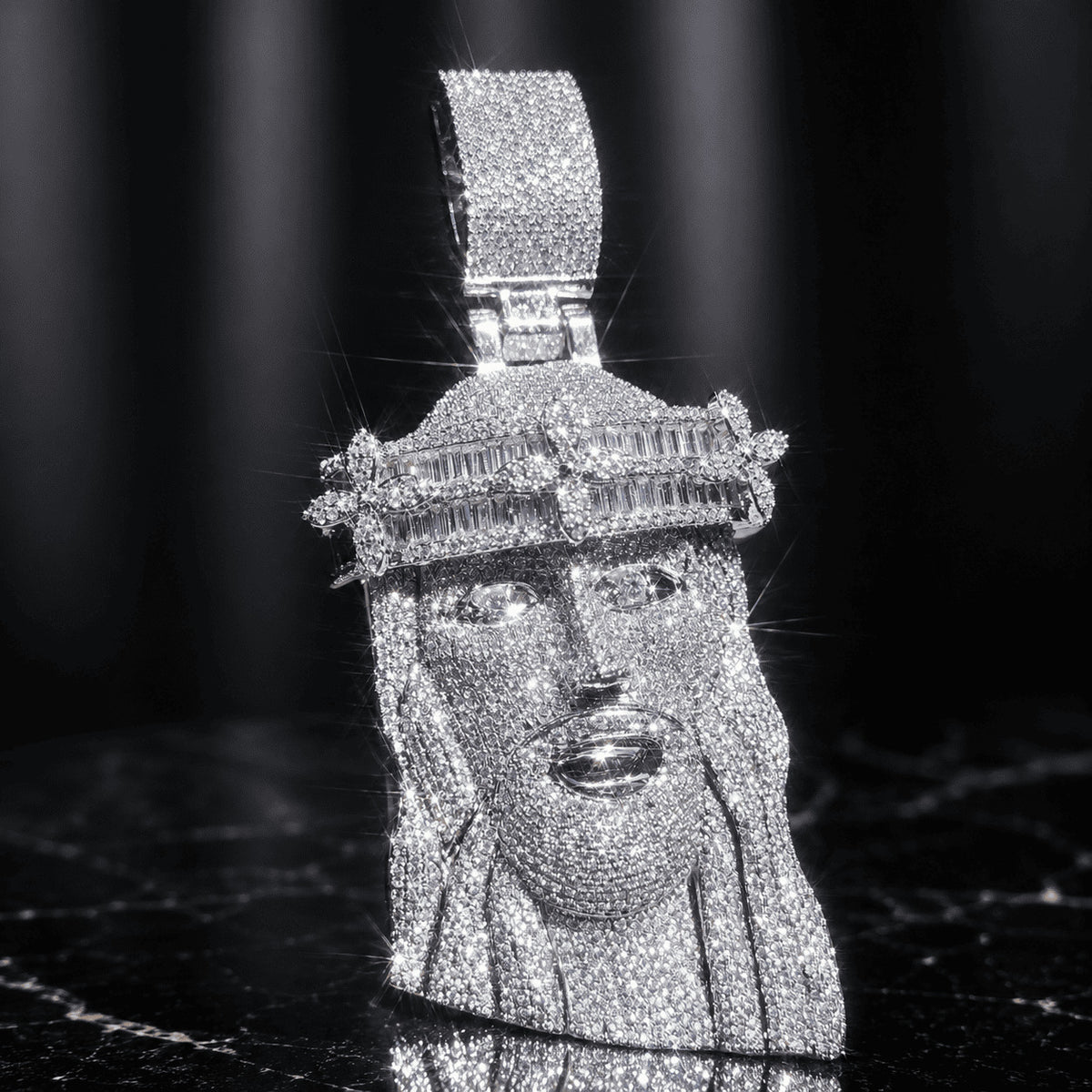 Brilliant silver-tone titanium steel Iced Out Baguette Crown Jesus Piece resting on a sleek black marble background.