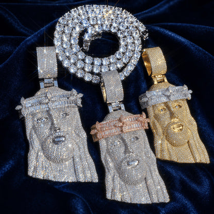Collection of three Iced Out Baguette Crown Jesus Pendants in multiple color finishes with a matching chain on dark blue velvet.