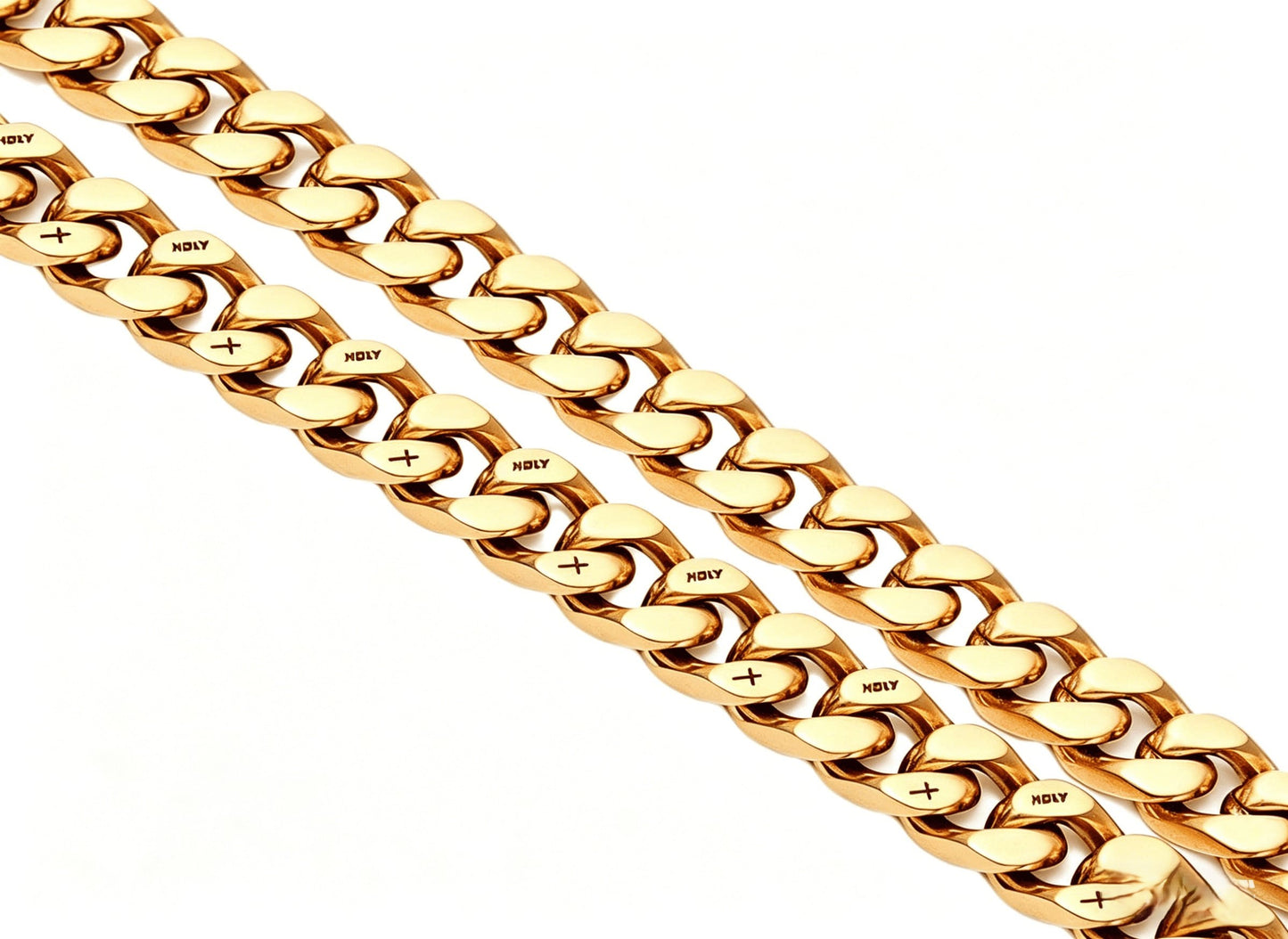 Coiled 12MM 18k gold cross Cuban link chain against a white background showing its wide link structure with its box clasp