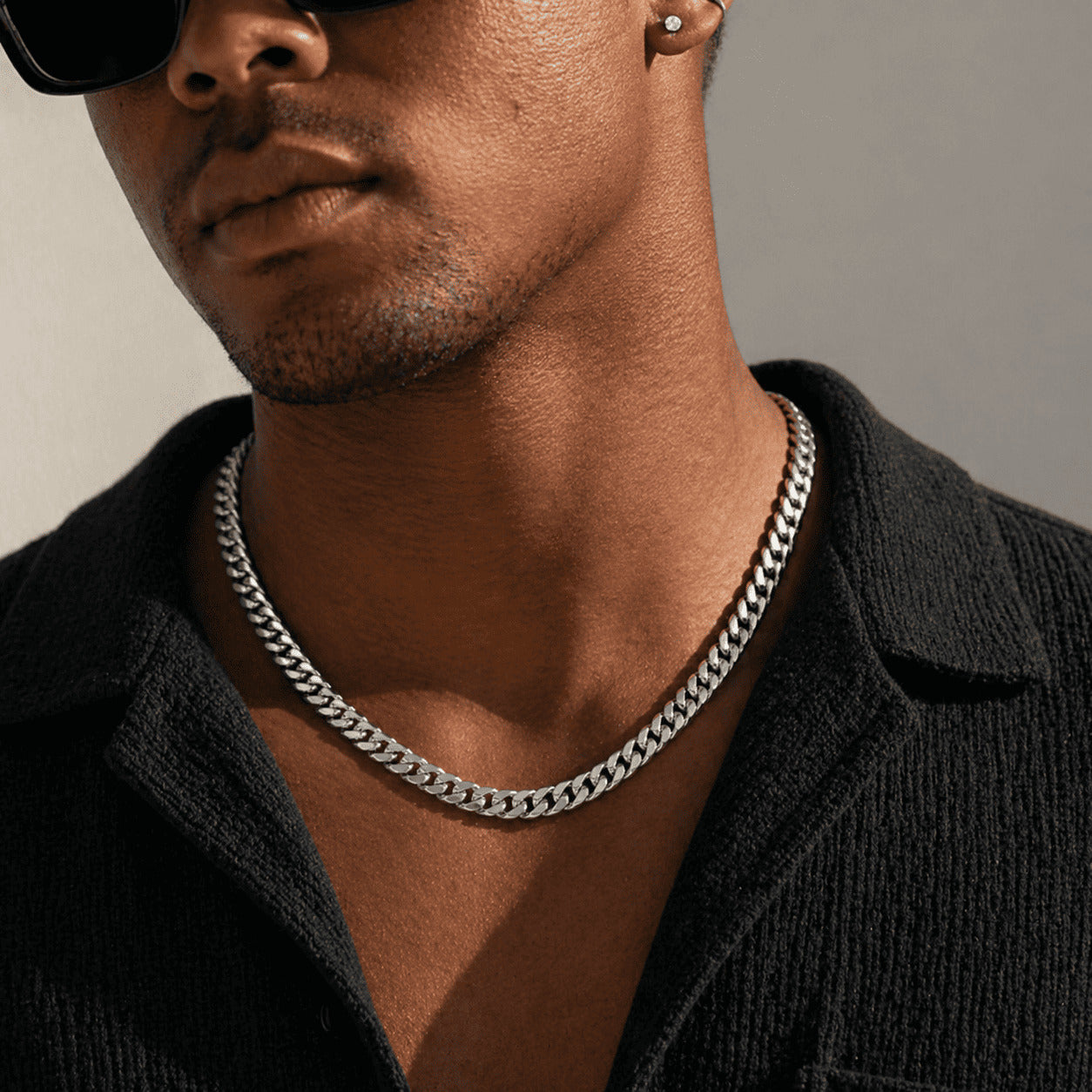 Model with sunglasses wearing an icegrind 6mm White Gold Miami Cuban Link Chain. Stylish everyday cuban link miami chain.