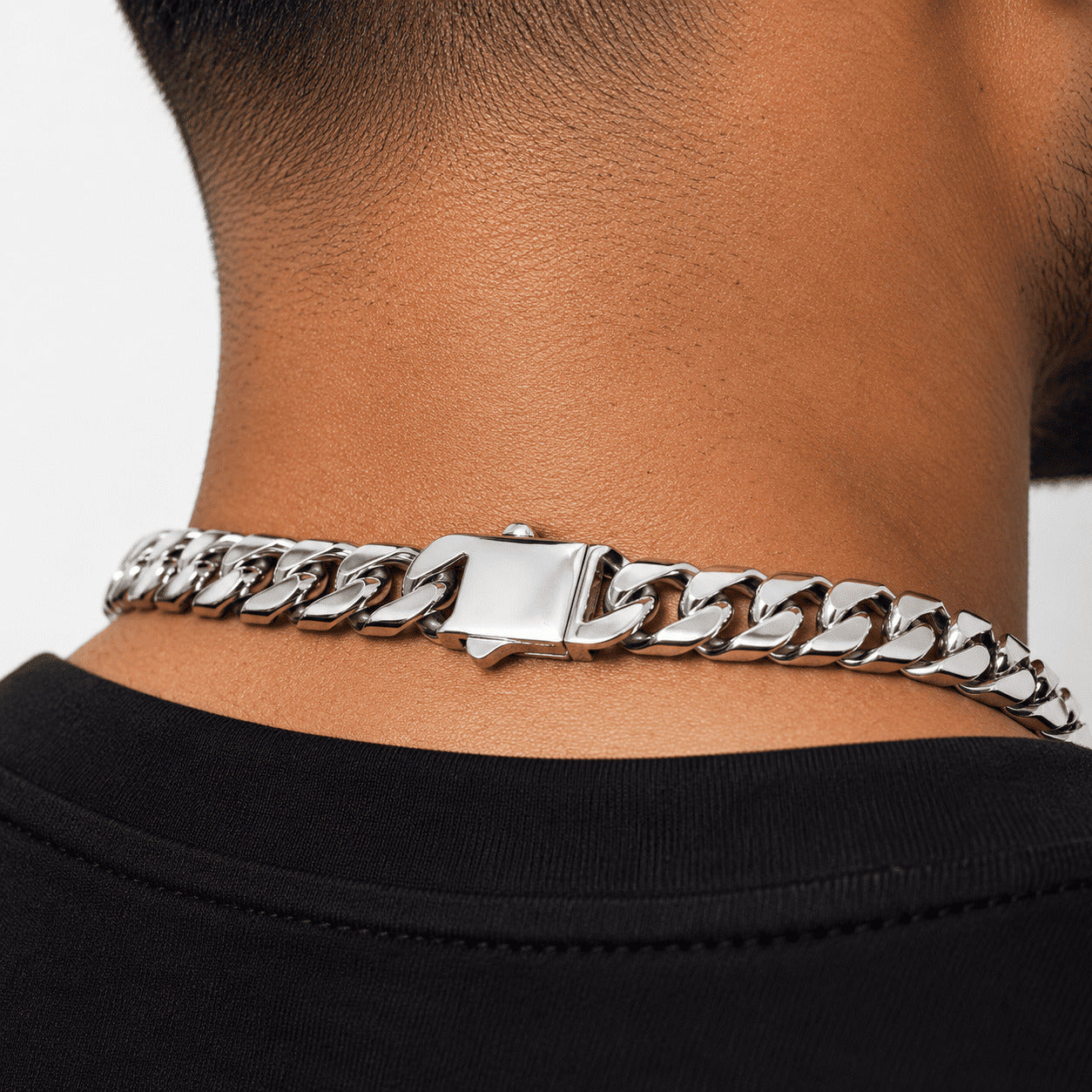 Rear view of the IceGrind 12MM Miami Cuban Link Chain resting on a man’s neck, showing the flat, comfortable fit and the aesthetic of the rear clasp.