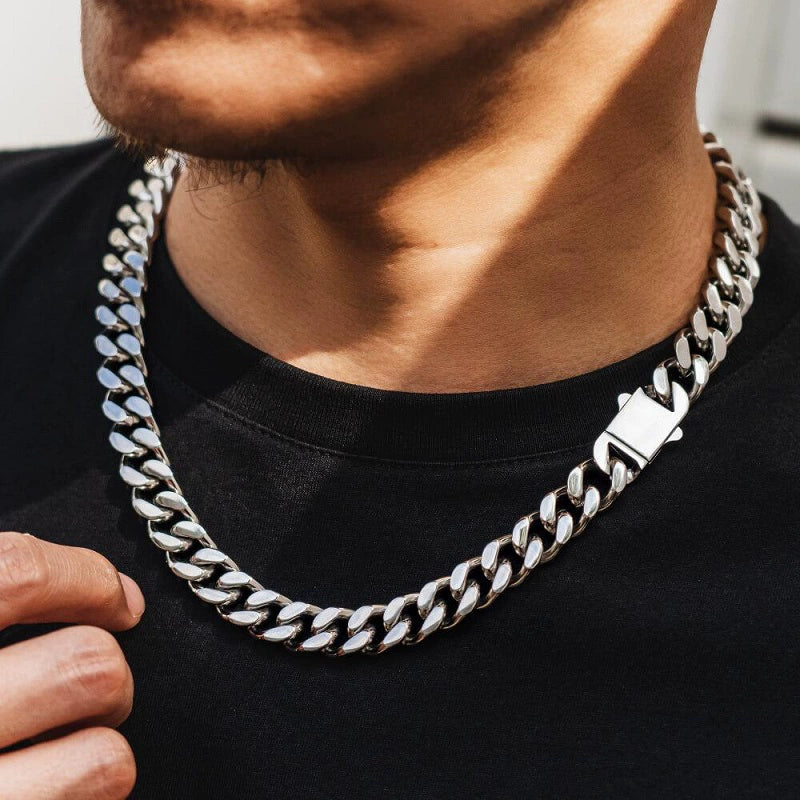 white gold Miami Cuban link chain worn around the neck over a black shirt