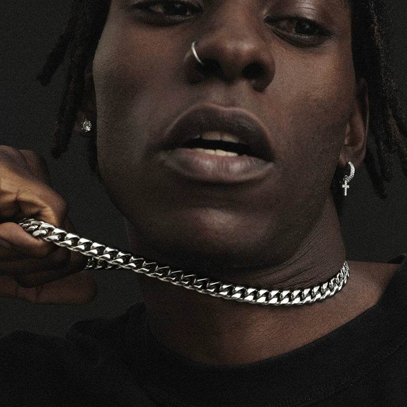 8MM white gold Miami Cuban link chain displayed on a model on a dark textured surface