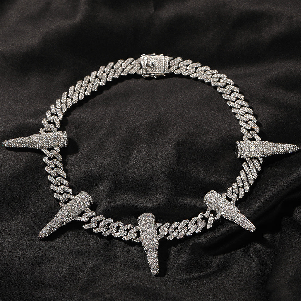 12MM white gold Cuban link chain with iced out bullet links displayed in a circular loop with its clasp visible