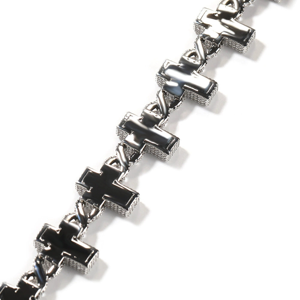 Close-up of chain links laid flat against a white background