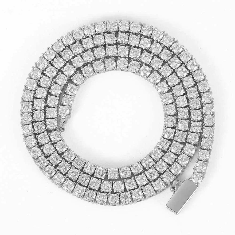 Coiled white gold tennis chain against a white background with its box clasp visible