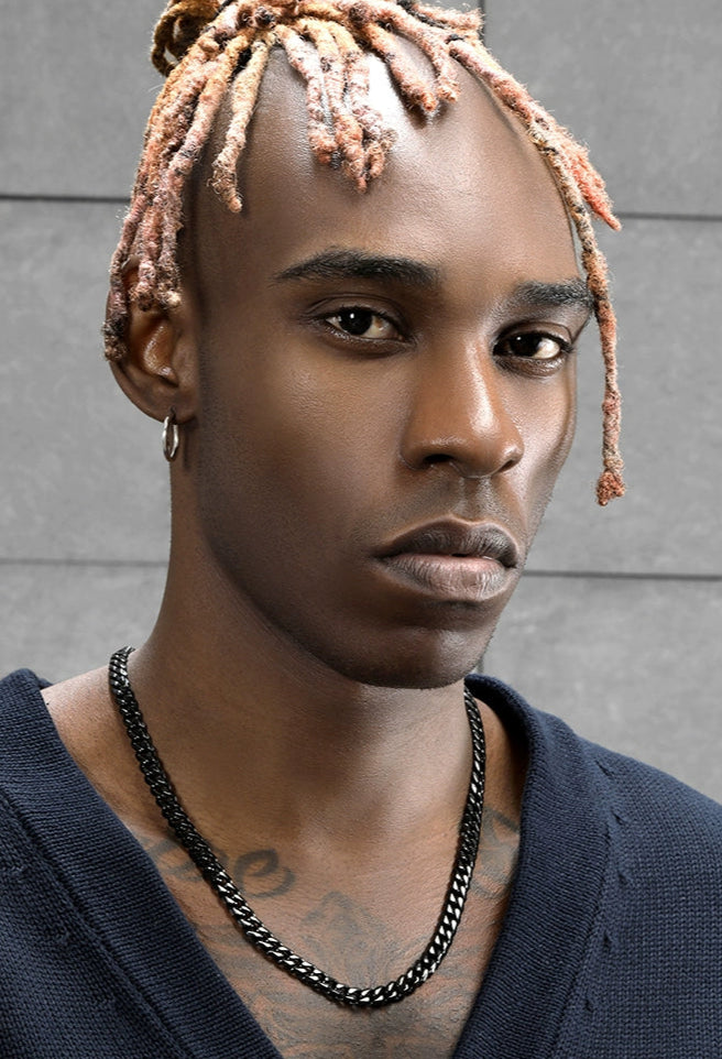 8MM black Cuban link chain worn around the neck in a model product view