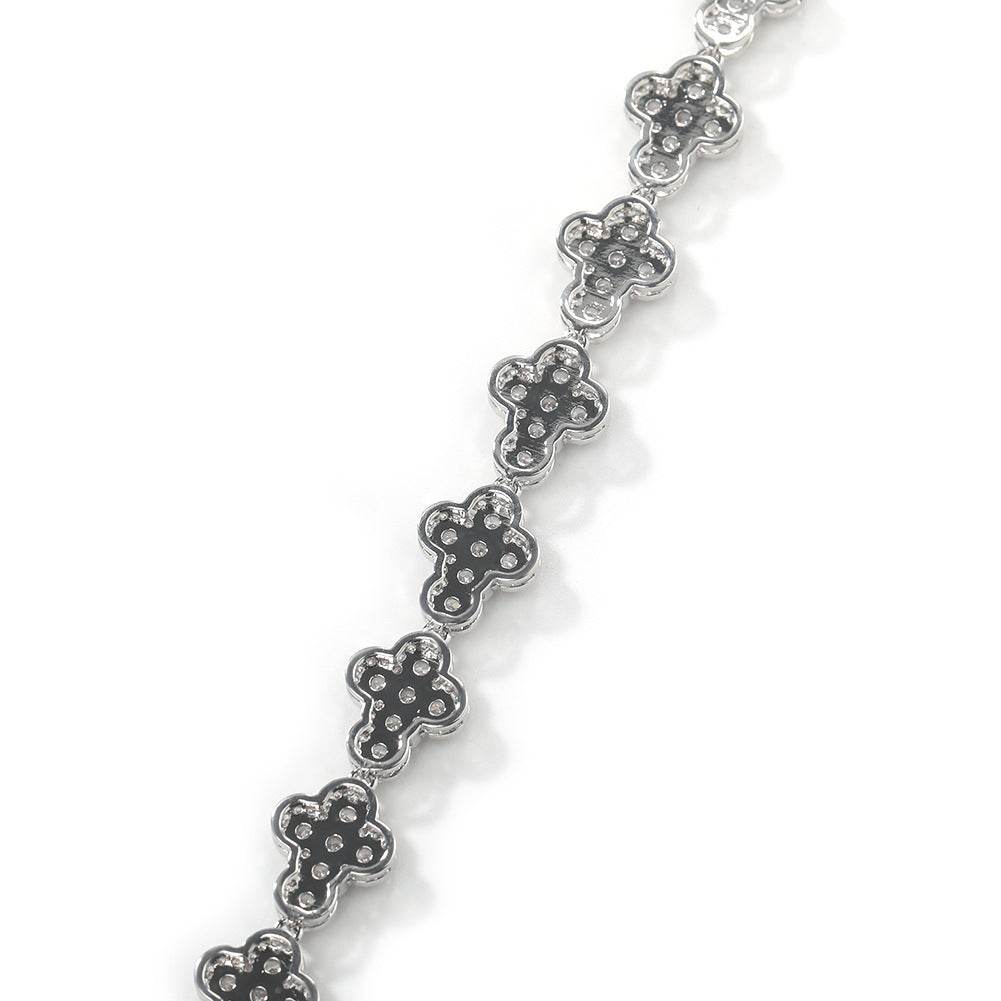 Close-up of chain links laid flat against a white background