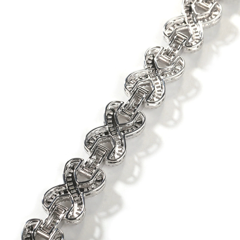 Close-up of chain links laid flat against a white background