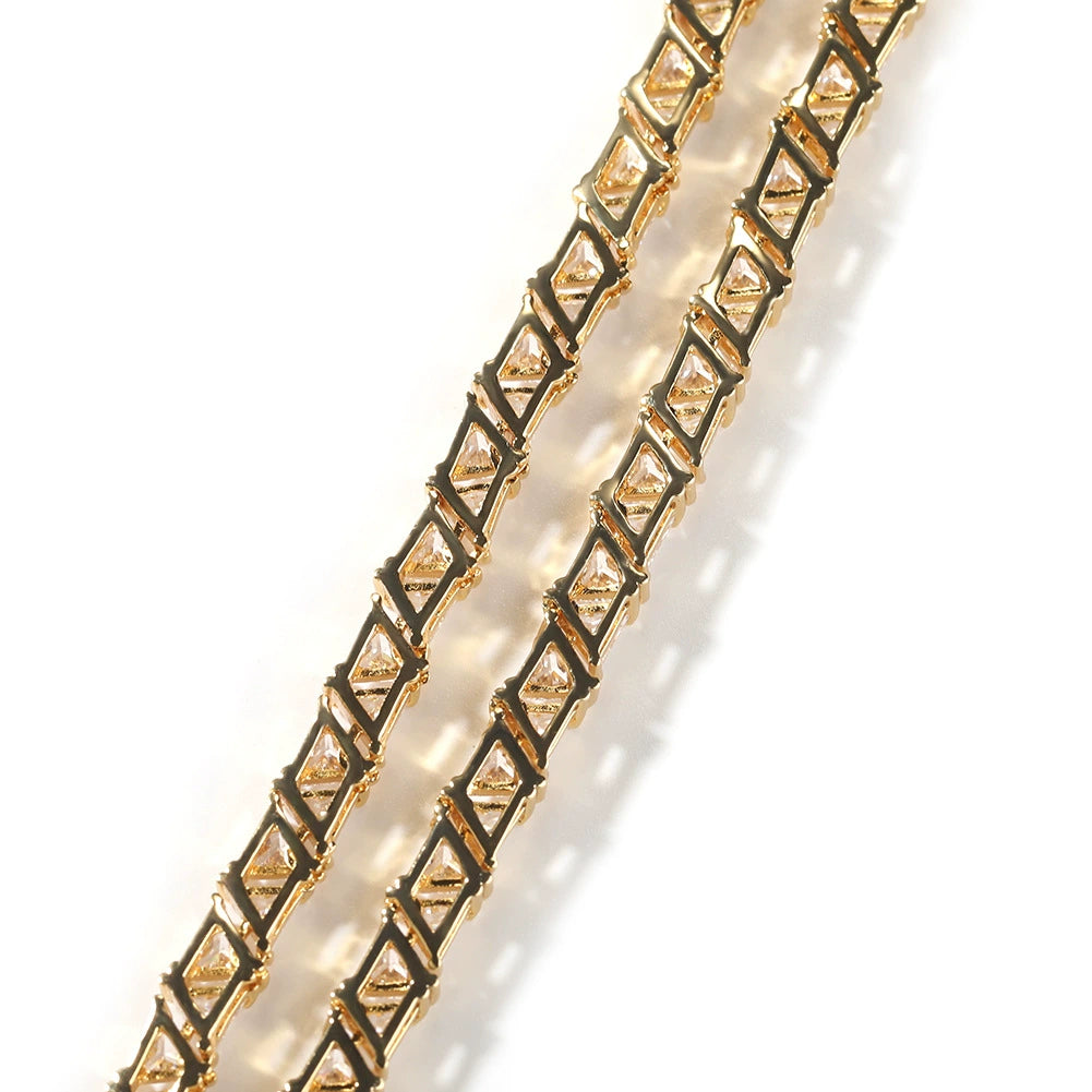 Close-up of tennis chain links laid flat against a white background