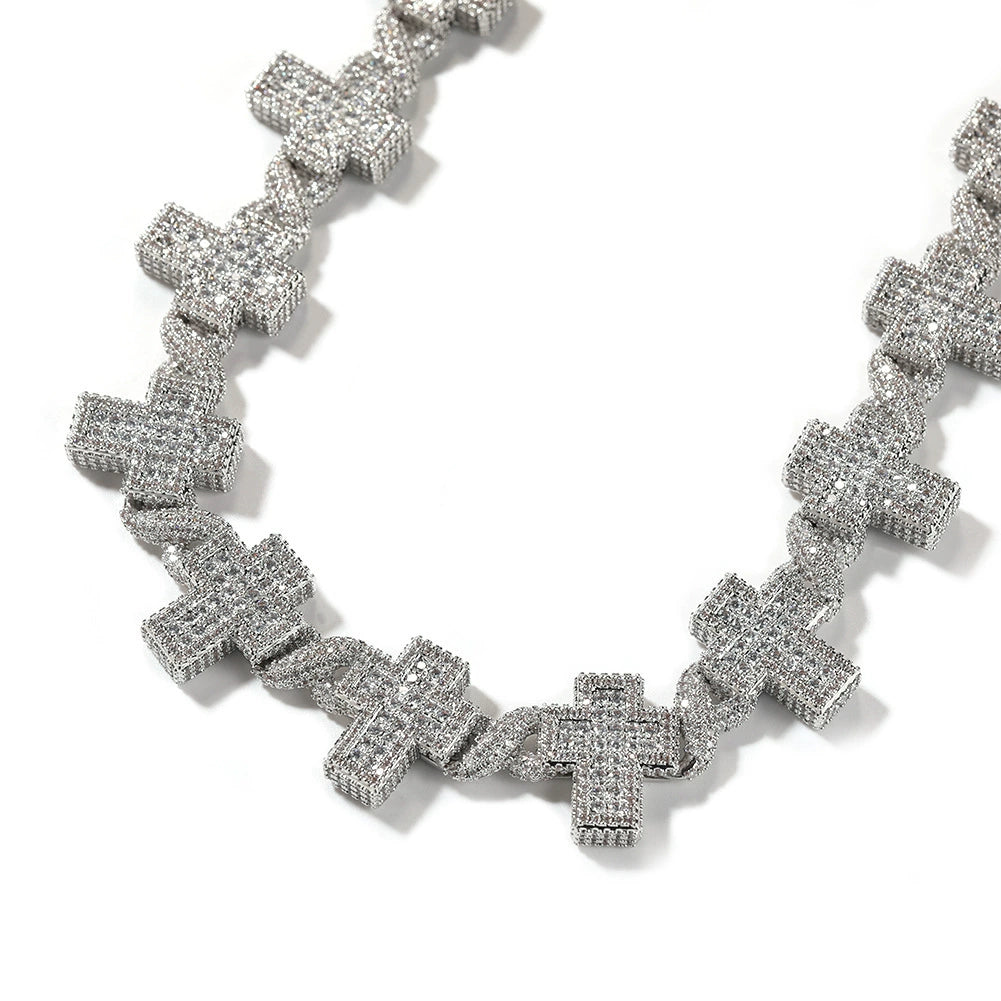 Curved 17MM white gold cross link chain laid against a white background