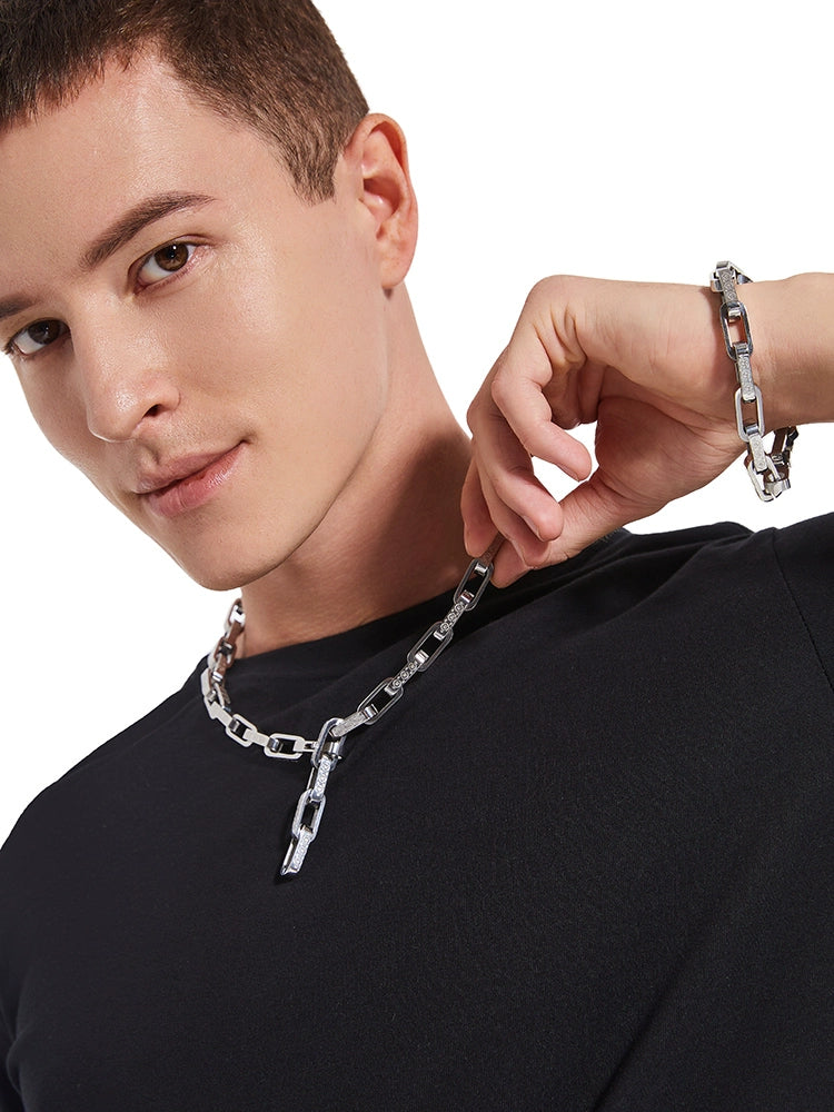 white gold chain shown as a necklace with matching bracelet on the wrist