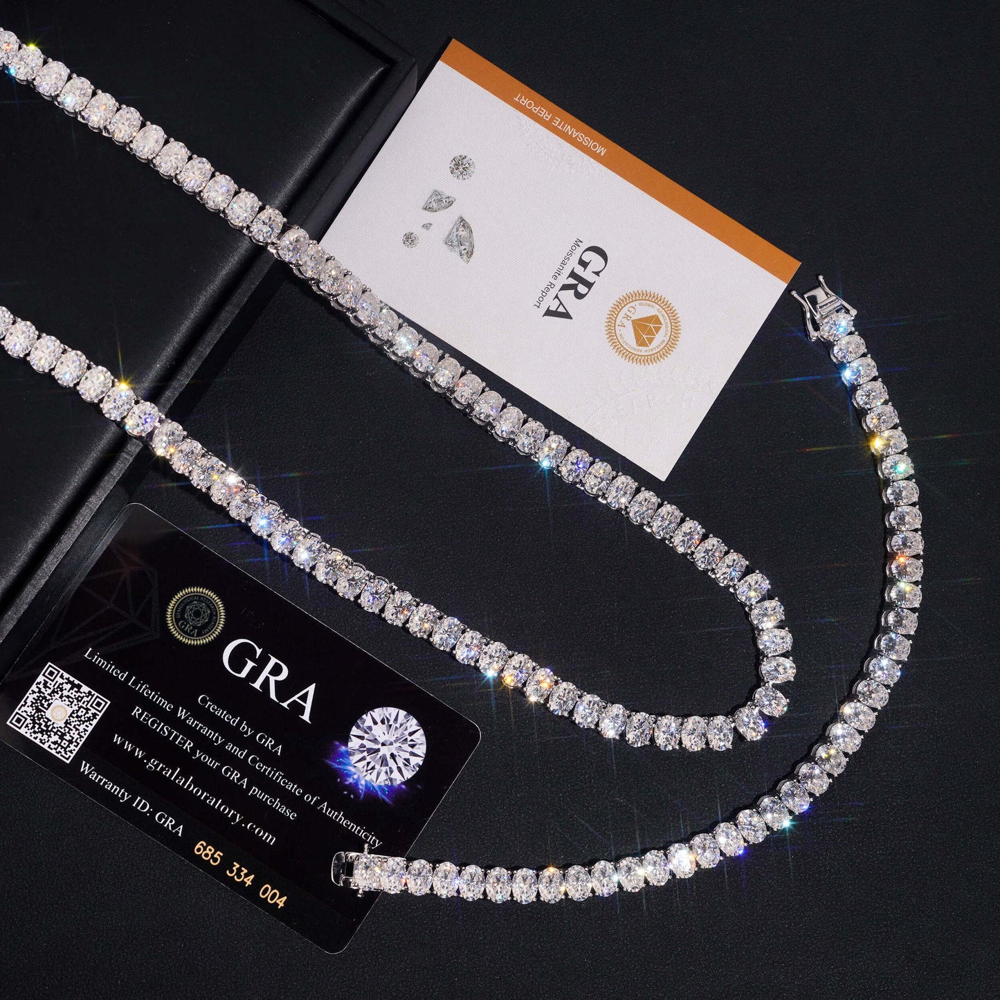 Curved 7MM moissanite tennis chain displayed with GRA certification cards