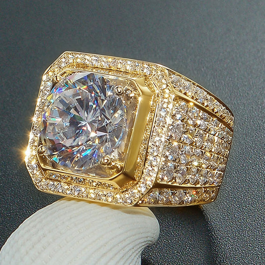Gold-tone ring with a clear center stone and multi-row stone band in an angled close-up