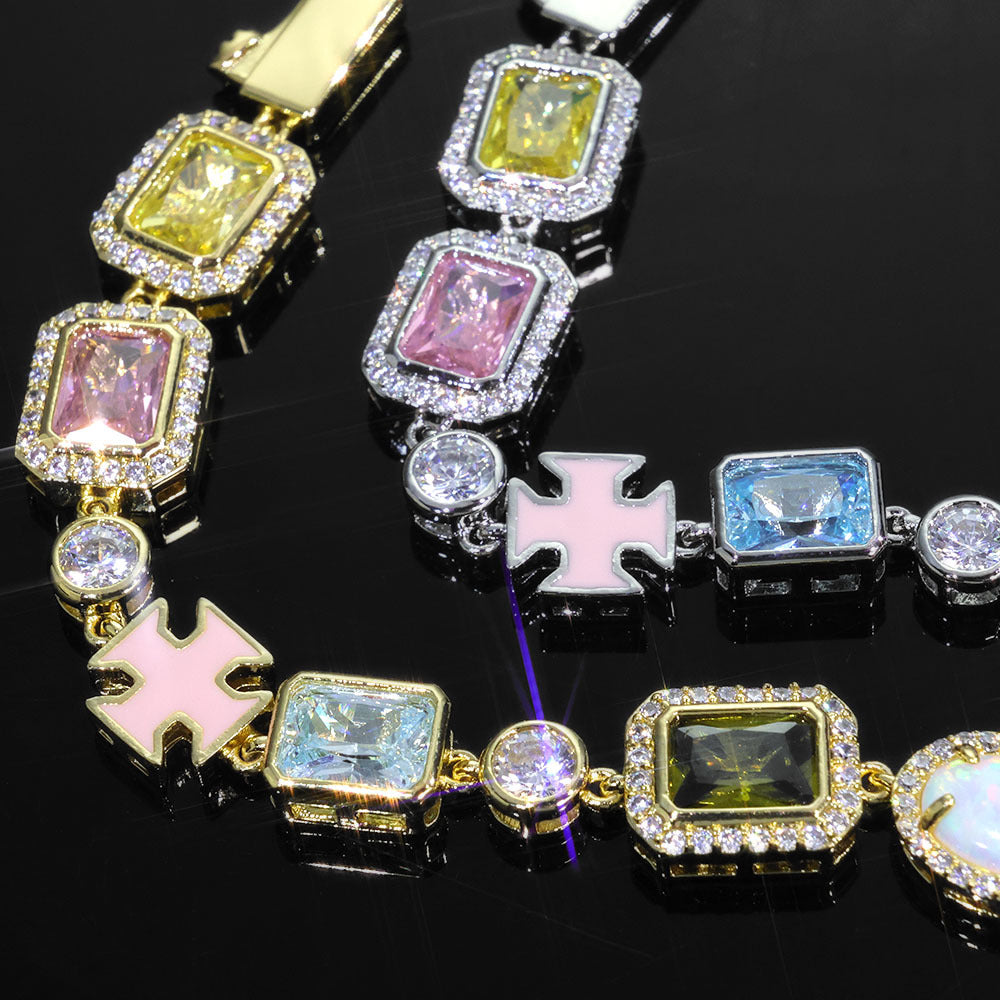 Curved chain layout with enamel crosses and varied gemstone colors