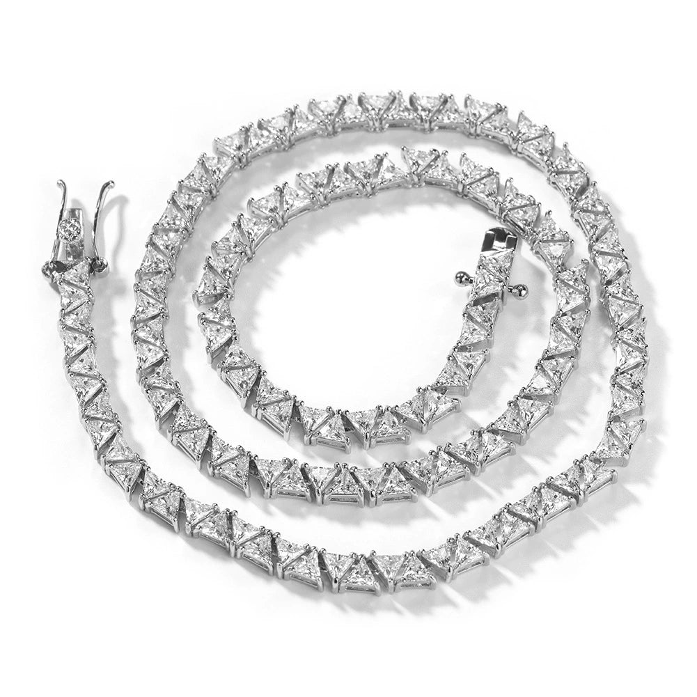 Coiled 5MM white gold pyramid tennis chain against a white background showing its wide link structure with its clasp visible