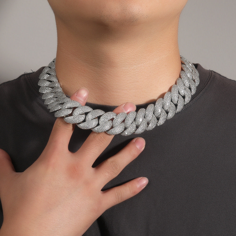24MM white gold Cuban link chain worn around the neck on a model for fit and style