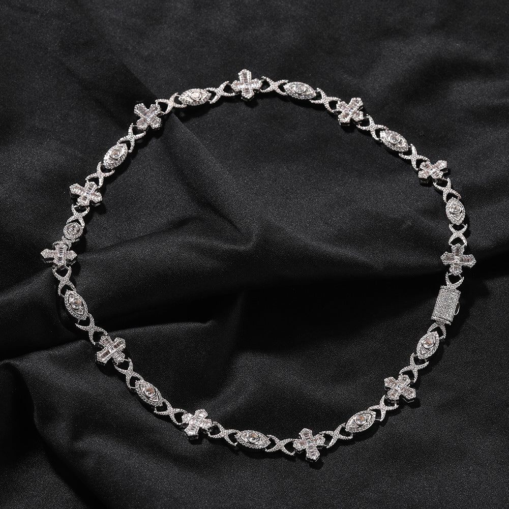 14MM white gold iced out evil eye cross link chain displayed in a circular loop on dark fabric showing its wide link