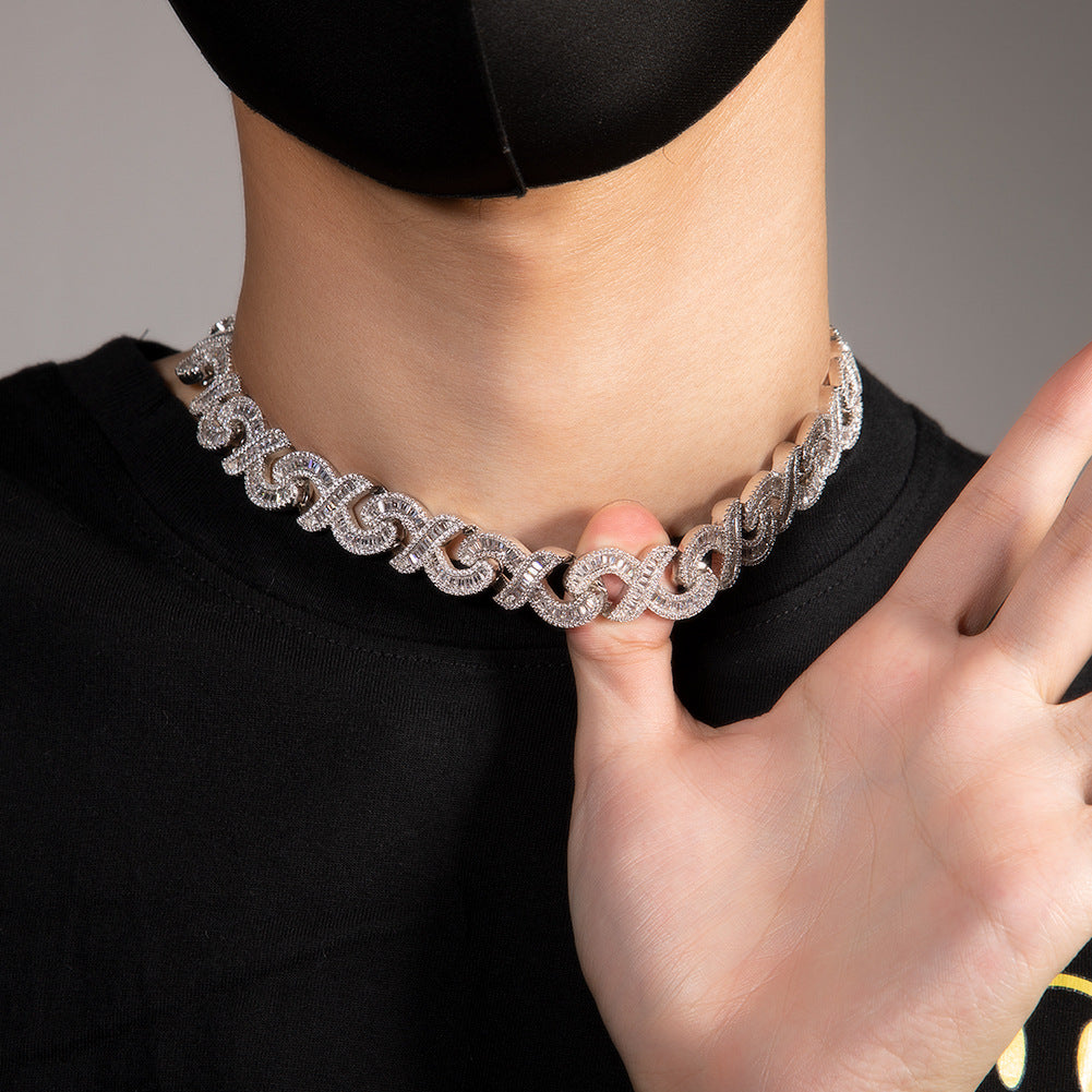 Miami Cuban link chain worn around the neck against a neutral background