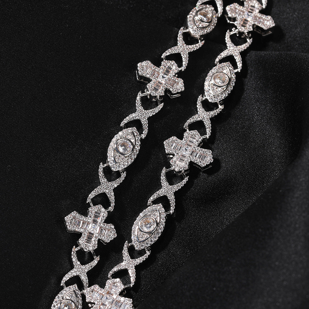 Close-up of 14MM white gold iced out evil eye cross link chain links laid flat