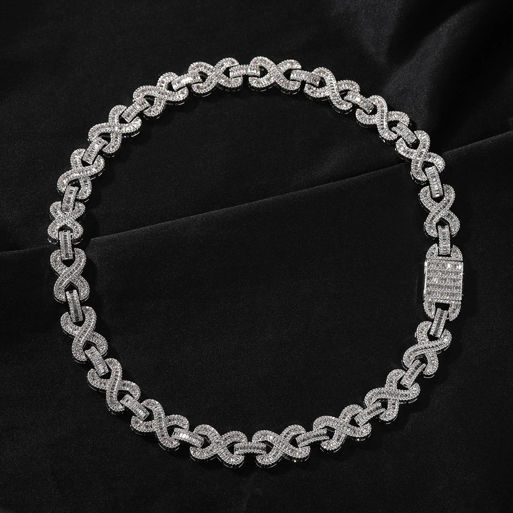 16MM white gold infinity link chain displayed in a circular loop on a dark textured surface showing its wide link structure