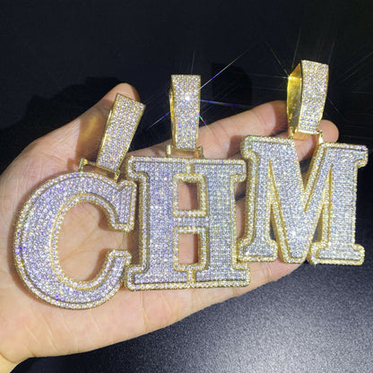 IceGrind gold initial pendant collection showing letters C, H, and M. Custom iced-out gold initial pendant necklaces.