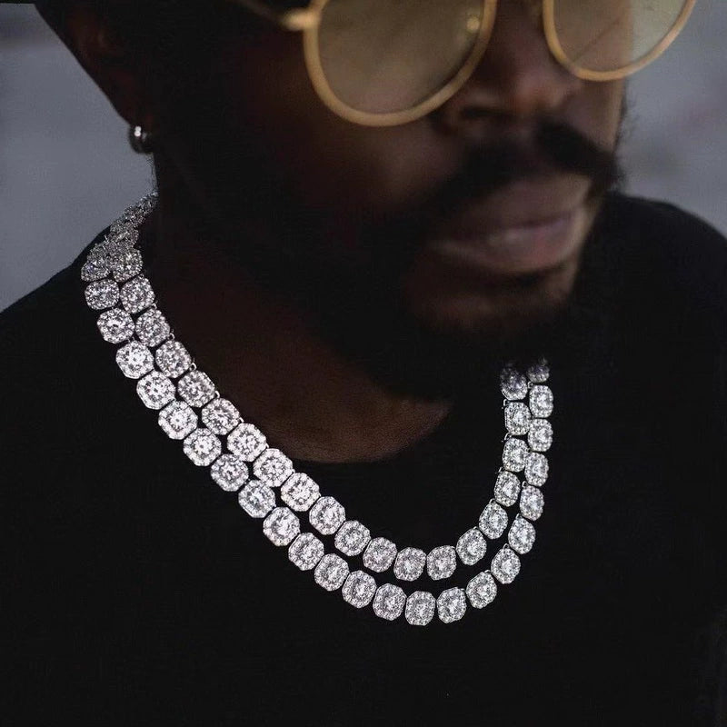 10MM white gold tennis chain worn around the neck on a dark textured surface