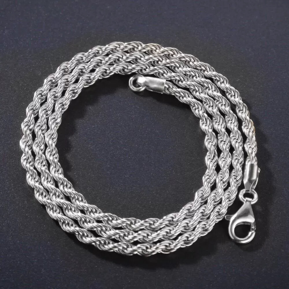 Coiled 3MM white gold rope chain against a dark background with its lobster clasp visible