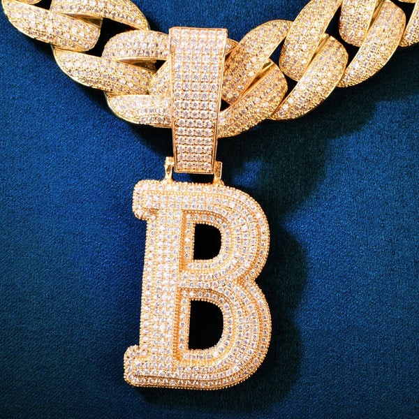 A chunky, 18K gold-plated B initial pendant, hand-set with VVS simulated diamonds, styled with a Miami Cuban link chain. Flawless gold initial pendant from IceGrind.
