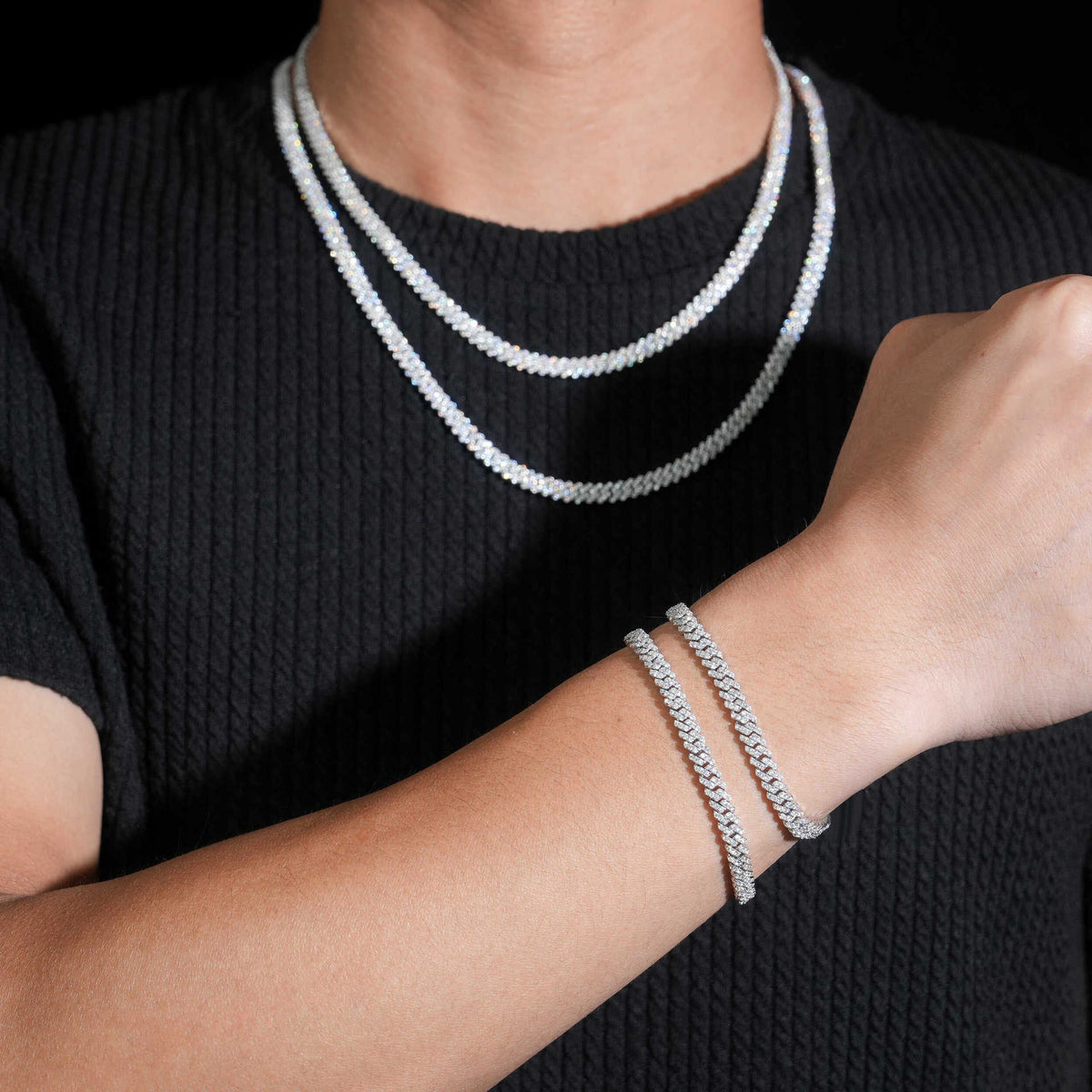 5MM moissanite Cuban link chain worn around the neck with a matching bracelet visible on the wrist
