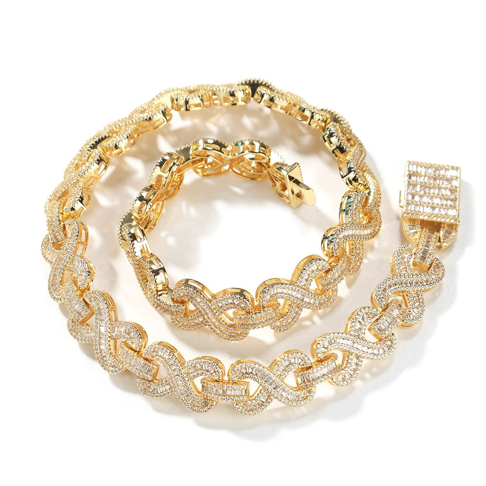Coiled 16MM gold infinity link chain against a white background with its box clasp visible