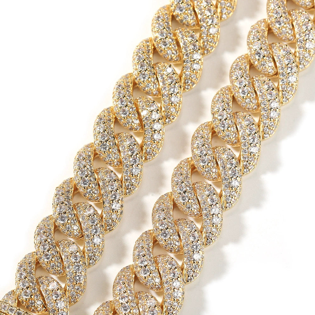 Close-up of 18MM 18k gold plated Cuban link chain links laid flat against a white background