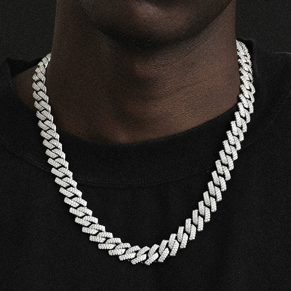 14MM white gold Cuban link chain worn around the neck on a model for fit and style over a black shirt