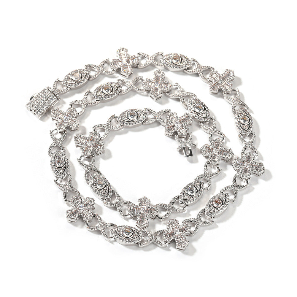 Coiled 14MM white gold iced out evil eye cross link chain against a white background with its box clasp visible
