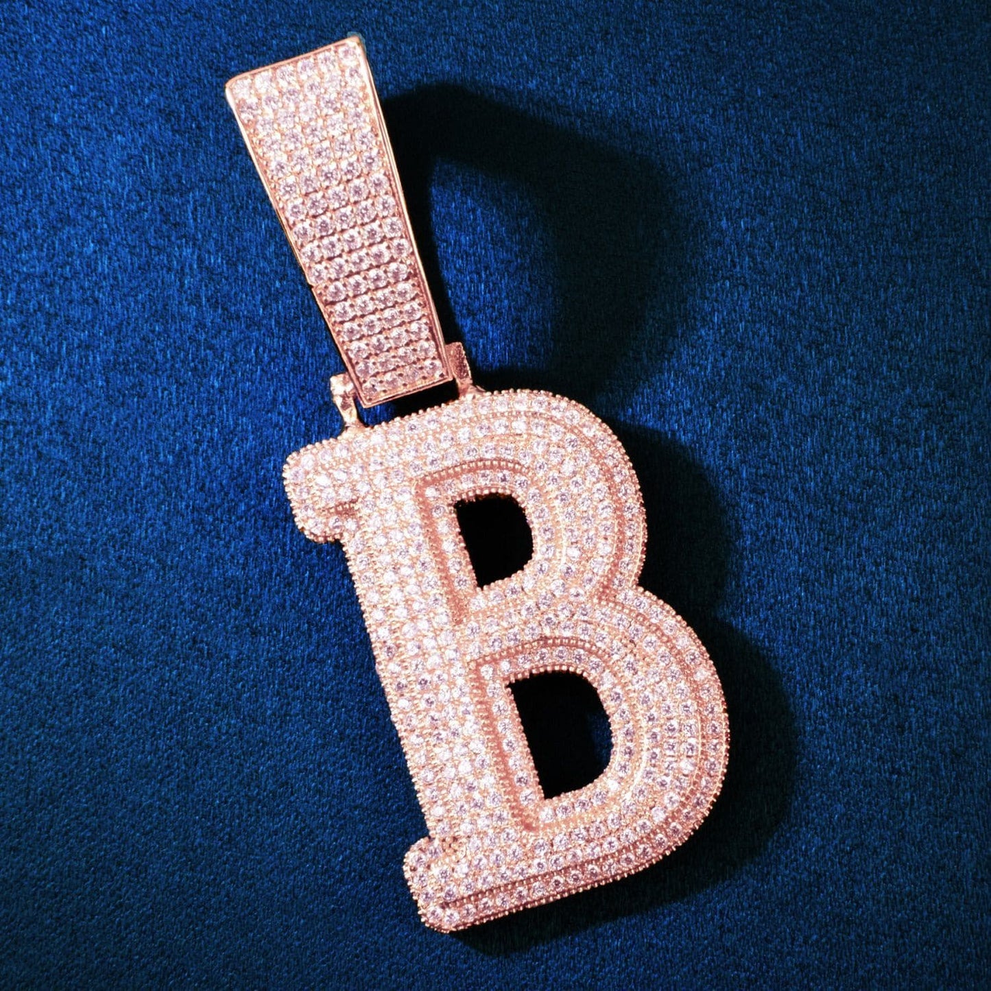 Front view of the large, iced-out B initial pendant by IceGrind. 18K gold-plated initial pendant necklace with VVS simulated diamonds for maximum hip hop shine.