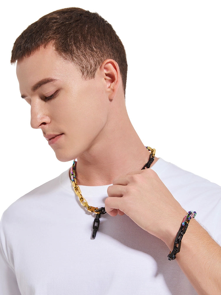 chain worn around the neck with a matching bracelet visible on the wrist