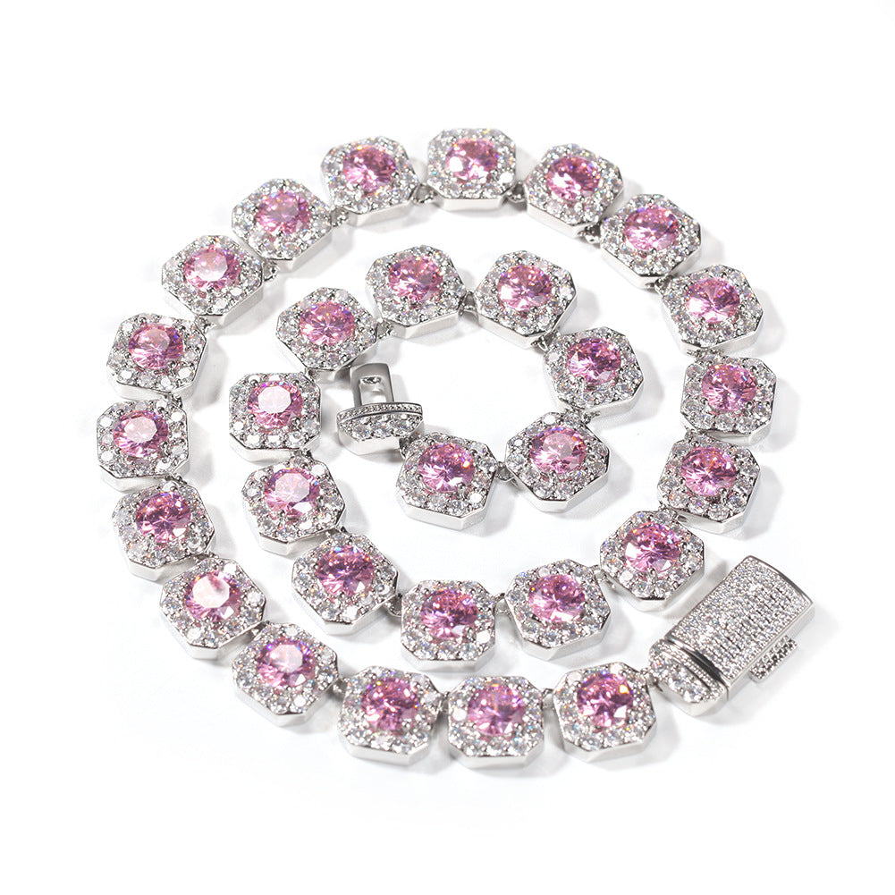 Coiled 12MM pink tennis chain against a white background with its box clasp visible