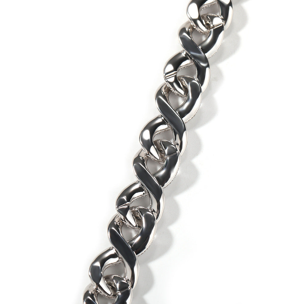 Close-up of Miami Cuban link chain links laid flat against a white background