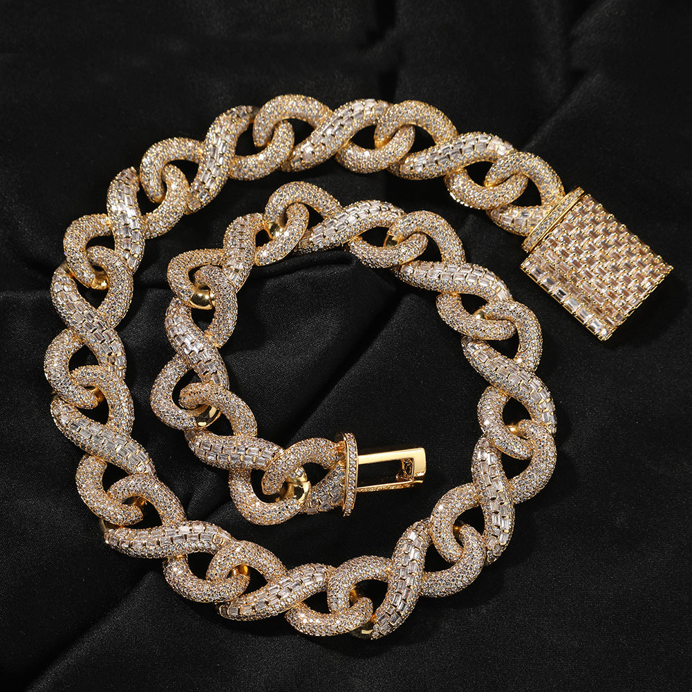 Coiled 16MM gold Cuban link chain with its box clasp visible