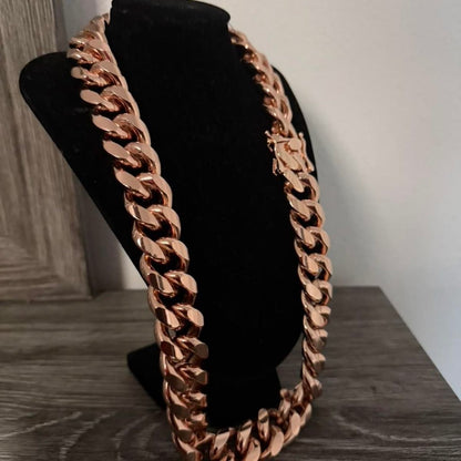 20MM rose gold Miami Cuban link chain draped over a black display bust with its box clasp visible