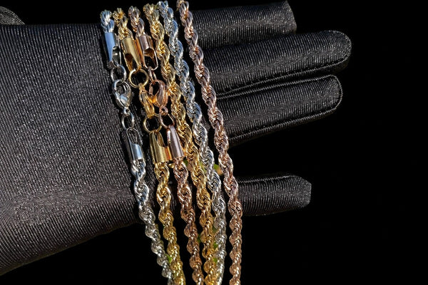 IceGrind rope chain collection featuring gold, silver, and rose gold rope chains on a black glove
