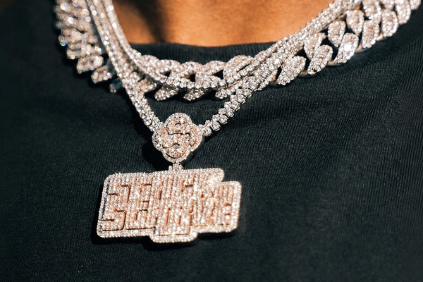 IceGrind silver chain collection featuring iced silver chains and a diamond pendant on a black shirt