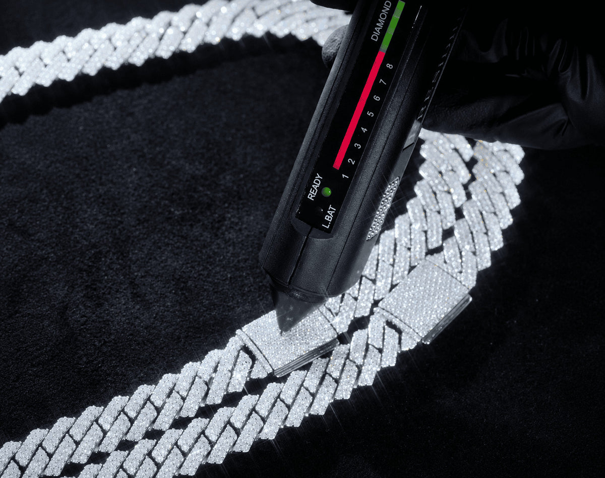 IceGrind moissanite chain tested with a diamond tester, showing real moissanite stone verification.